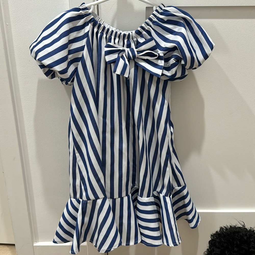 White and blue striped dress with bow in front
